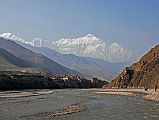 Mustang 01 02 Kagbeni And Nilgiri As we walked along the Kali Gandaki riverbed just after leaving Kagbeni, I looked back to see Nilgiri towering above the village.